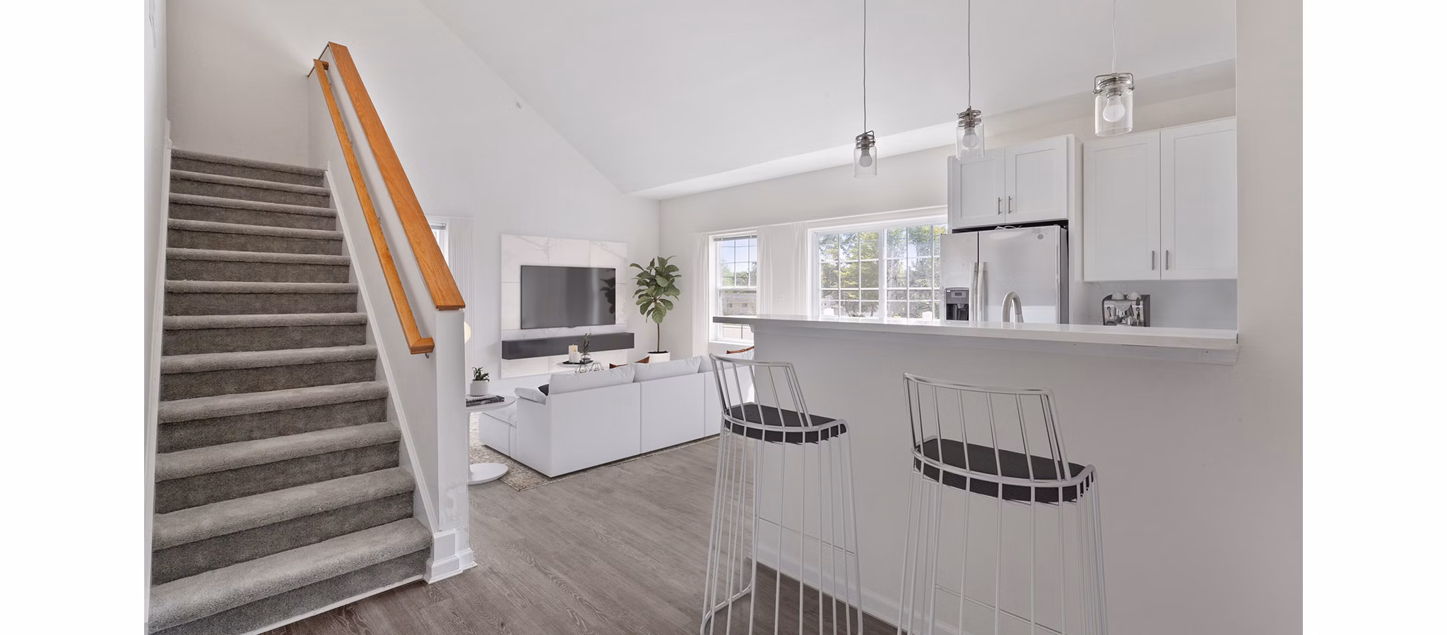 Modern kitchen with stainless steel appliances in The Cornerstone Hauppauge Apartments