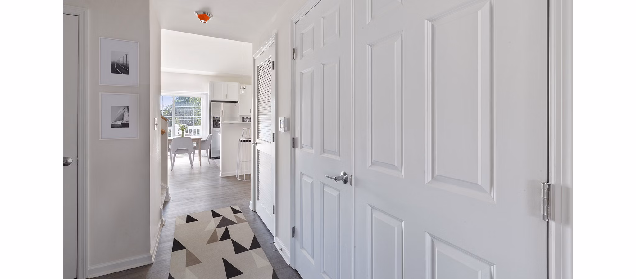 Modern kitchen with stainless steel appliances in The Cornerstone Hauppauge Apartments