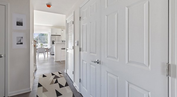 Modern kitchen with stainless steel appliances in The Cornerstone Hauppauge Apartments