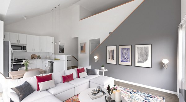 Spacious living room with modern furnishings in The Cornerstone Hauppauge Apartments