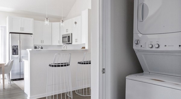 Laundry room with modern appliances at The Cornerstone Hauppauge Apartments