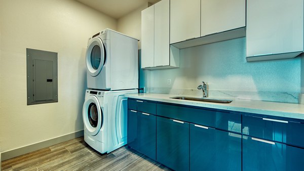 laundry room at Aura Watermark Apartments