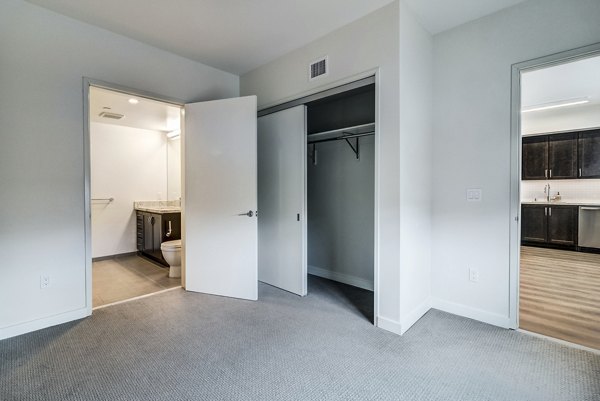 Elegant bedroom with modern design and stylish decor at 777 Tenn Apartments in the heart of luxury living