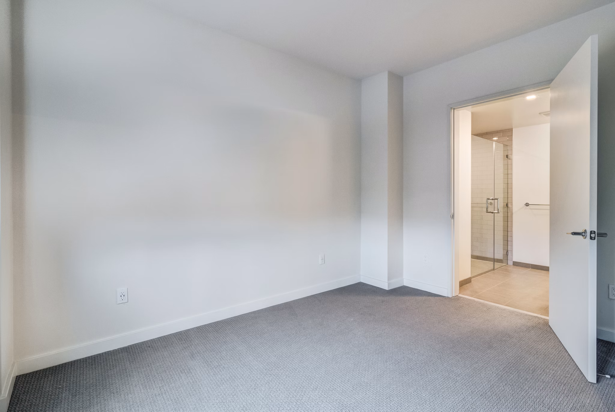Cozy bedroom with modern decor at 777 Tenn Apartments offering luxurious comforts in Nashville