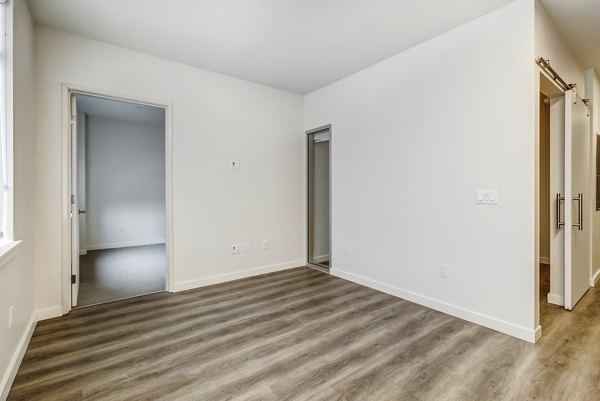 Contemporary bedroom with modern furnishings at 777 Tenn Apartments, offering luxury living in a prime location