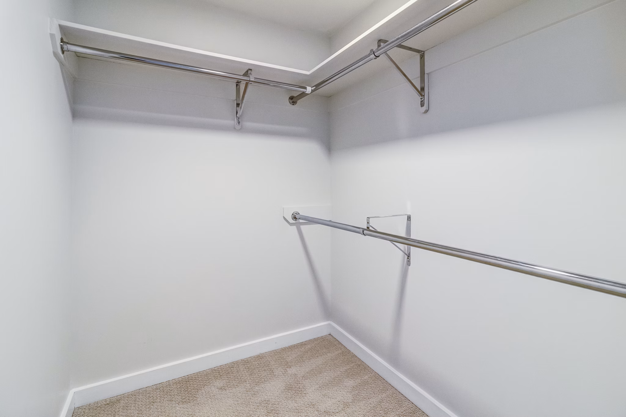 Organized bedroom closet with modern shelving in 777 Tenn Apartments