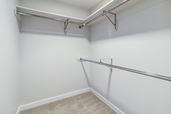 Organized bedroom closet with modern shelving in 777 Tenn Apartments