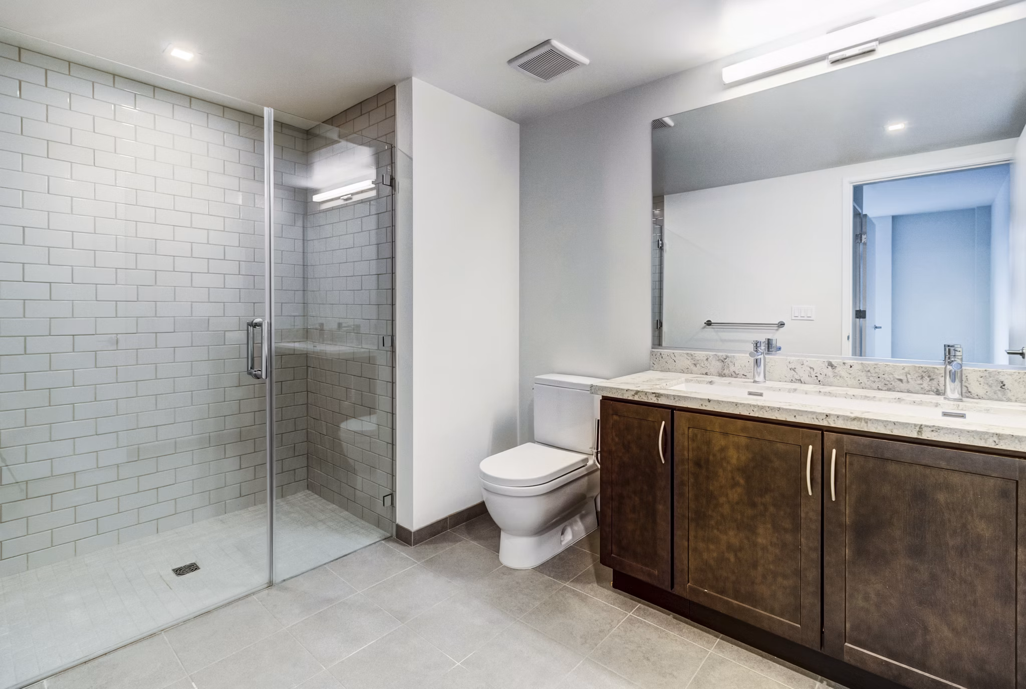 Modern bathroom with marble countertops at 777 Tenn Apartments