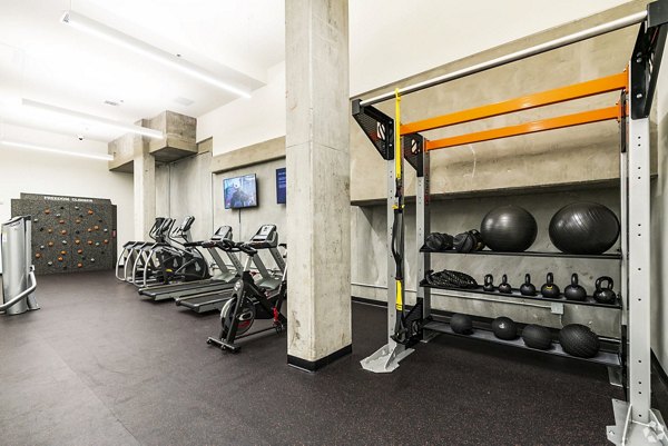 Fitness center with modern equipment at 777 Tenn Apartments, offering residents a dedicated space for exercise and well-being