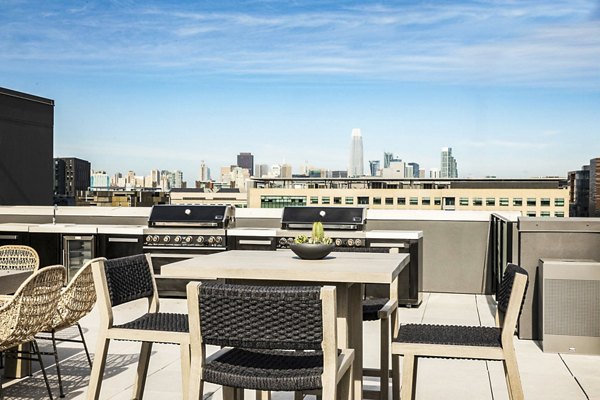 Inviting grill area on spacious patio at 777 Tenn Apartments, perfect for gatherings and relaxation in the heart of vibrant city living