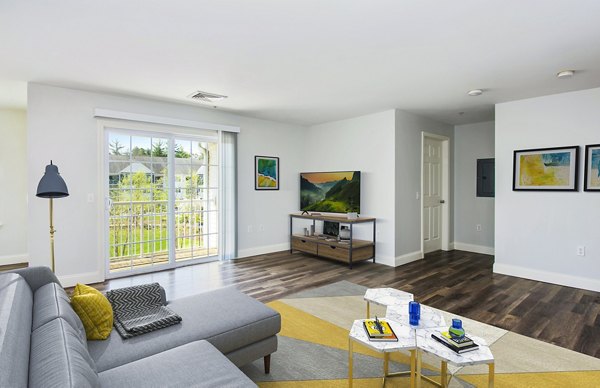 living room at Heritage at Bedford Springs Apartments