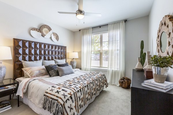 Cozy bedroom with modern furnishings at Overture Albuquerque Apartments for luxurious living