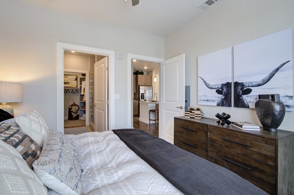 Modern bedroom with sleek furnishings at Overture Albuquerque Apartments, a luxury living community offering stylish and comfortable spaces
