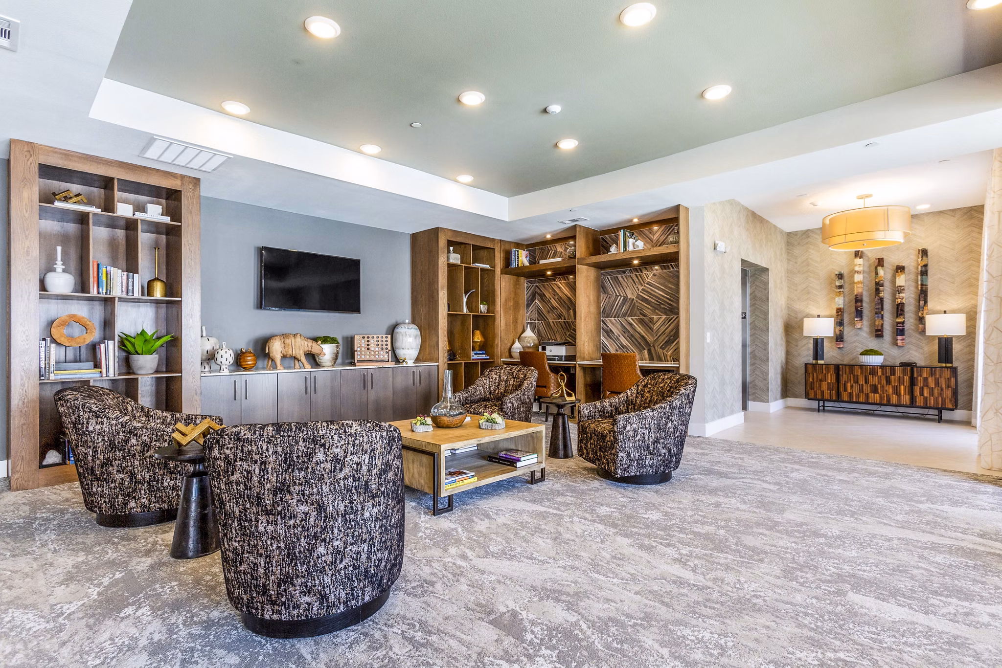 Overture Albuquerque: Chic clubhouse lobby with modern decor and seating areas, ideal for gatherings and relaxation at luxury apartments