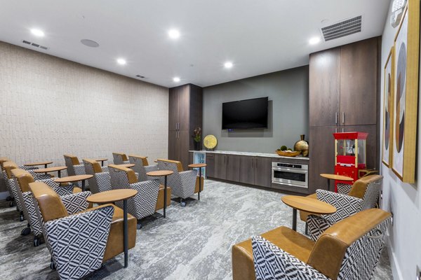 Theater room with plush seating at Overture Albuquerque Apartments