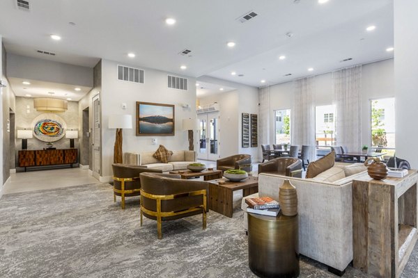 Clubhouse lobby featuring modern decor and seating at Overture Albuquerque Apartments