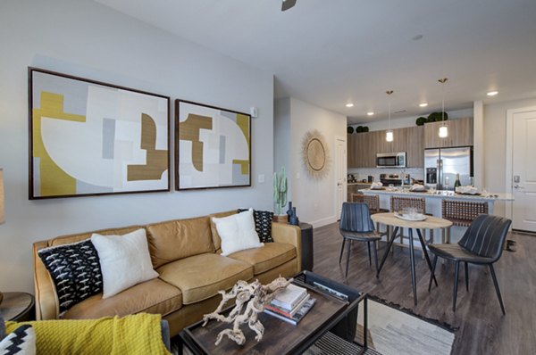 Interior space showcasing elegant kitchen layout in Overture Albuquerque Apartments, featuring modern appliances and sleek countertops