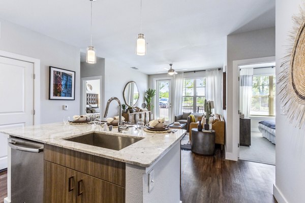 Modern kitchen with stainless steel appliances at Overture Albuquerque Apartments