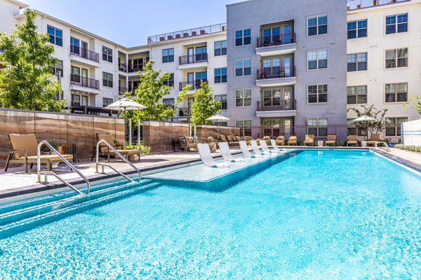 Rooftop pool with lounge seating at Overture Albuquerque Apartments, offering luxury amenities for residents
