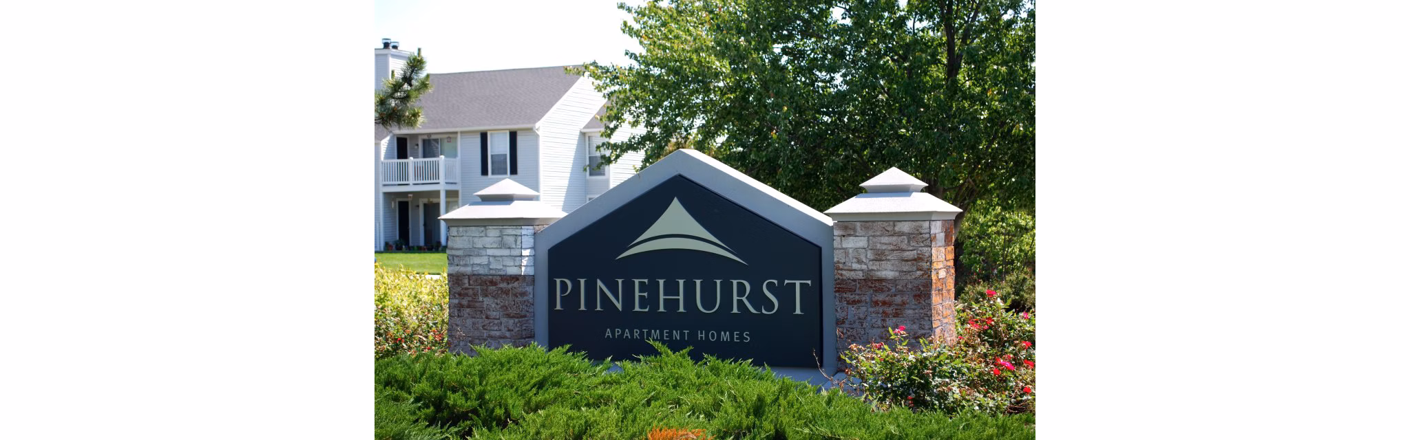 Pinehurst Apartments: Welcoming signage at luxury property entrance