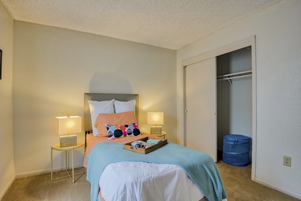 Spacious bedroom with elegant decor at Pinehurst Apartments, a luxury living space by Greystar