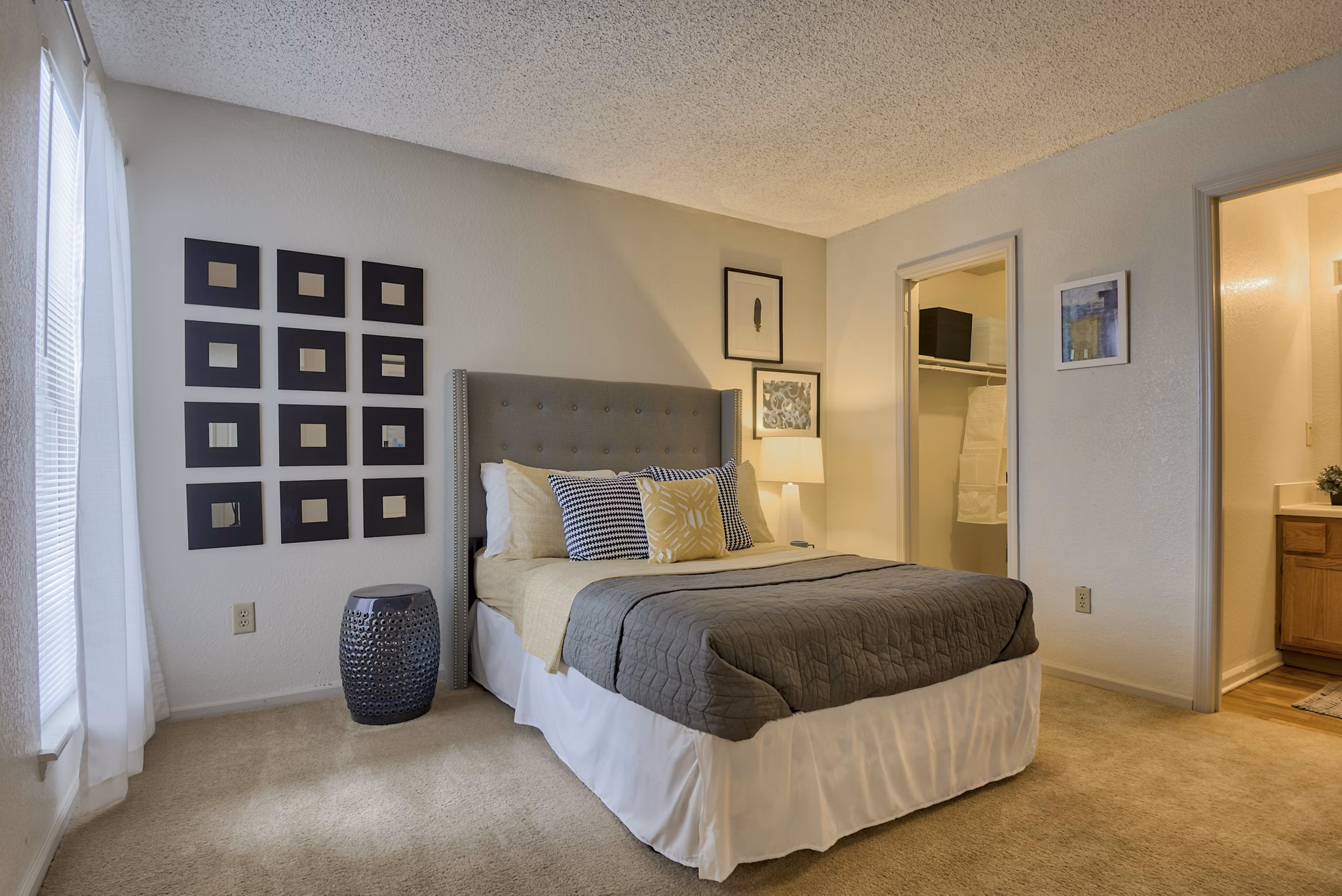 Spacious bedroom featuring modern design and natural light at Pinehurst Apartments