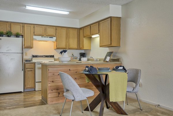 Dining room featuring elegant furnishings and modern lighting at Pinehurst Apartments