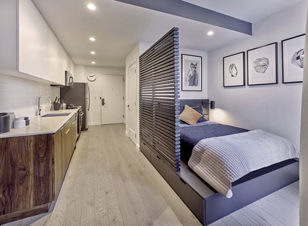 Spacious bedroom with modern decor at 7 Seventy House Apartments in Hoboken, ideal for luxury living