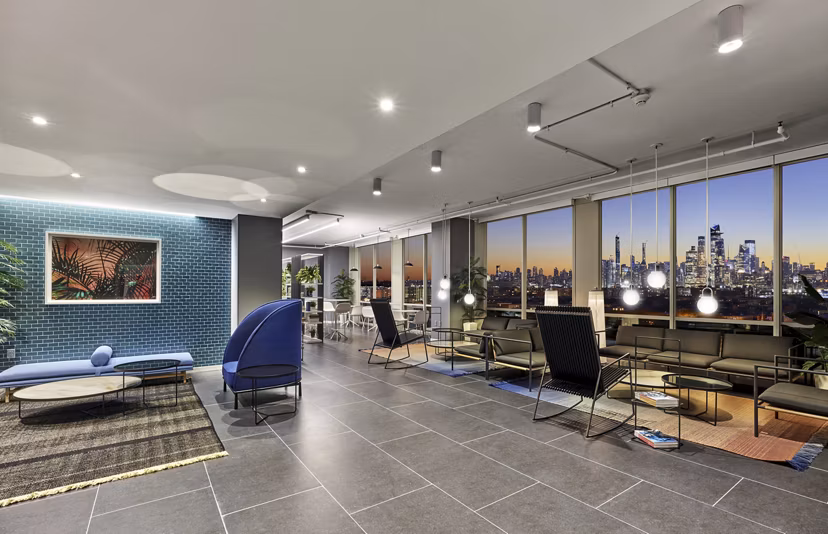 Expansive clubhouse with modern furnishings at 7 Seventy House Apartments, ideal for social gatherings and events