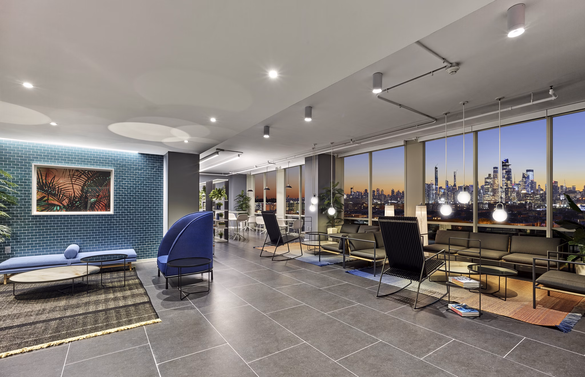 Expansive clubhouse with modern furnishings at 7 Seventy House Apartments, ideal for social gatherings and events