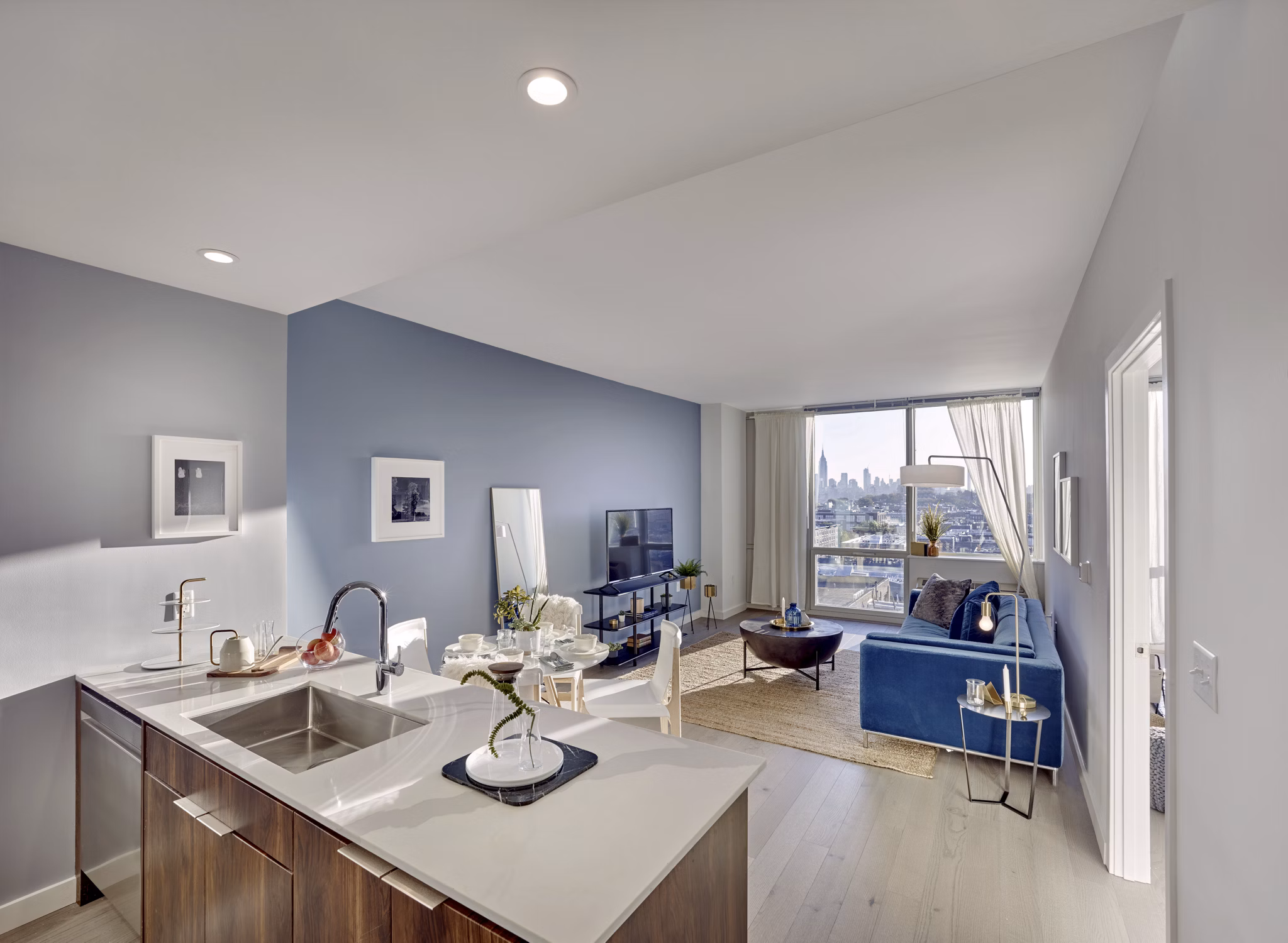 Dining area with modern decor and large windows at 7 Seventy House Apartments