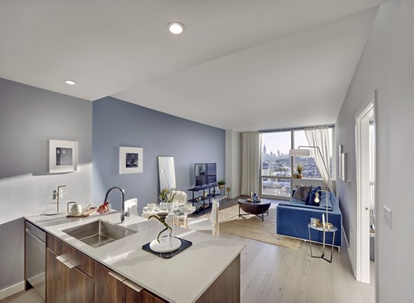 Dining area with modern decor and large windows at 7 Seventy House Apartments