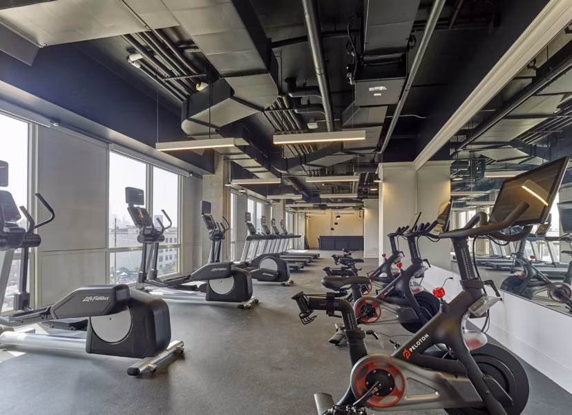 Modern fitness center with state-of-the-art equipment at 7 Seventy House Apartments