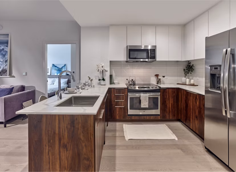 Modern kitchen with stainless steel appliances at 7 Seventy House Apartments, designed for luxury living in Hoboken