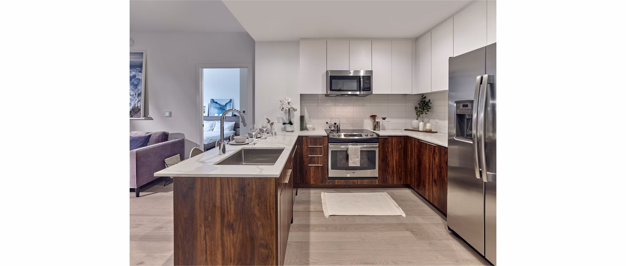 Modern kitchen with stainless steel appliances at 7 Seventy House Apartments, designed for luxury living in Hoboken