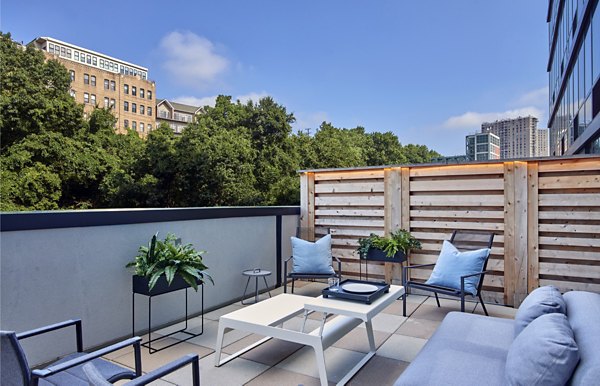 Outdoor patio space with stylish furnishings at 7 Seventy House Apartments