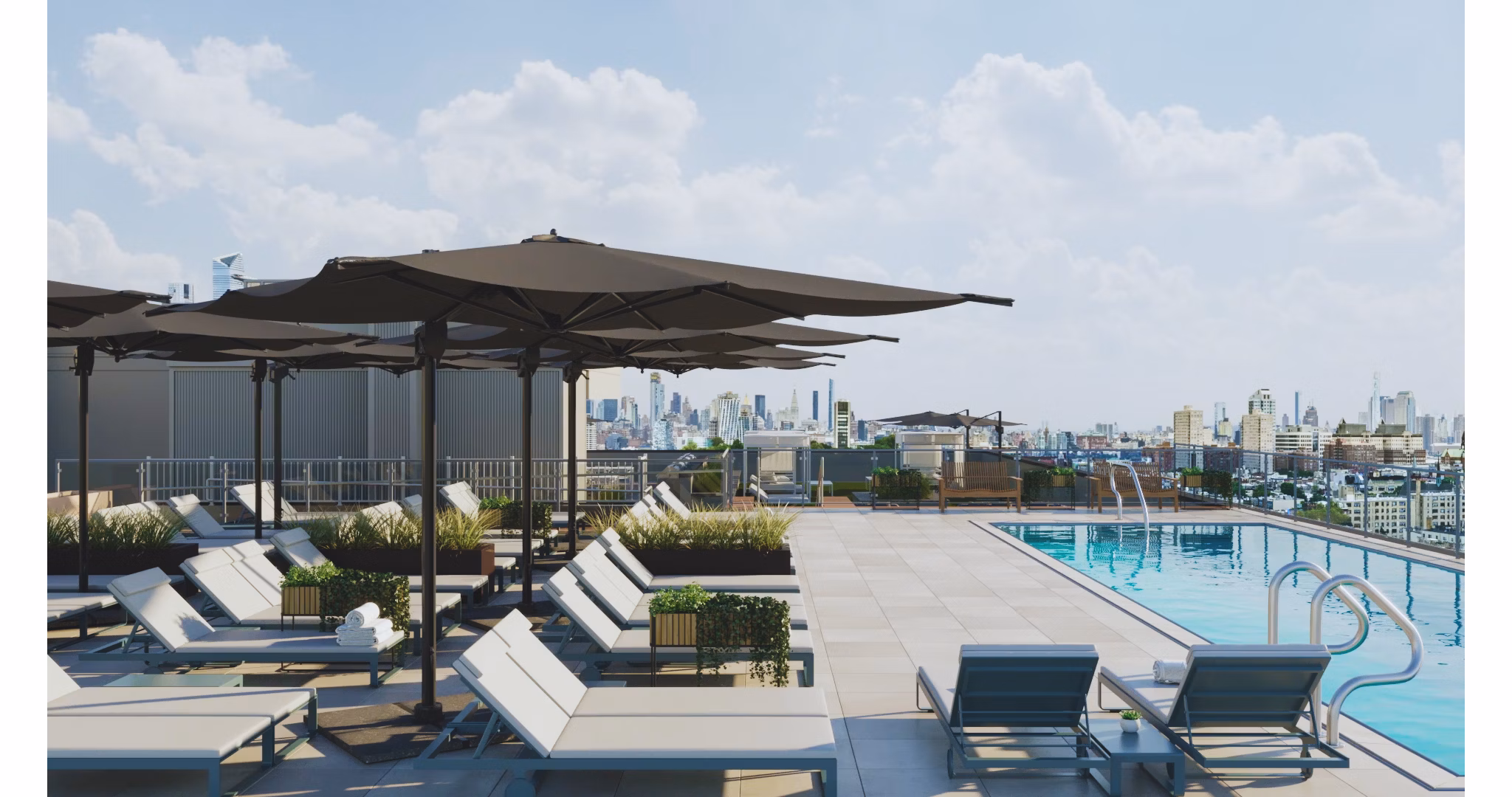 Modern pool with lounge chairs at 7 Seventy House Apartments, offering luxury amenities and relaxation spaces in a prime location