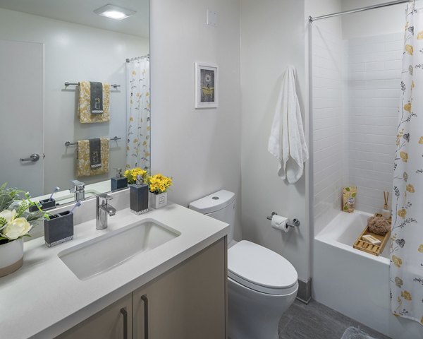 Bathroom featuring sleek fixtures and marble accents at The Union Apartments in modern luxury apartment living