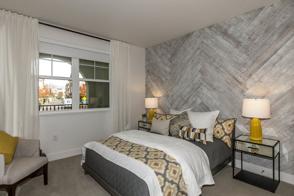 Cozy bedroom with modern decor in Encasa Apartments
