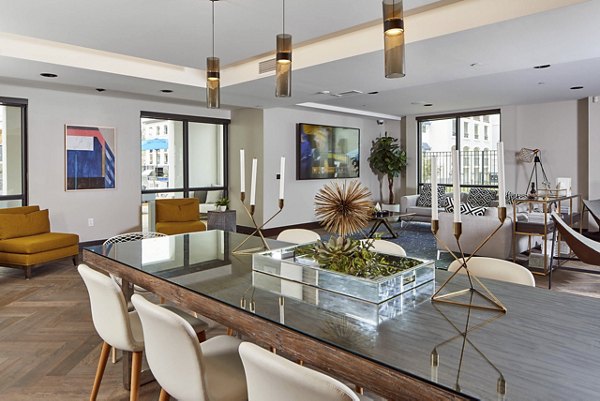 Spacious living and dining area featuring contemporary decor and elegant furnishings in luxury apartments