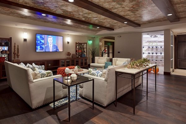 Modern living room with a large sectional sofa and decorative plants in luxury apartment