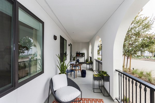 Chic patio area with modern seating at Encasa Apartments, a Greystar luxury apartment community
