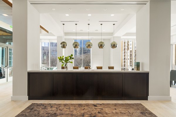 Clubhouse at Piedmont House: Modern social space with seating and game areas in luxury Piedmont House Apartments, Atlanta