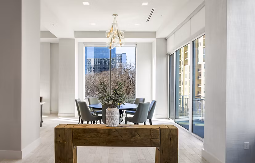 Modern designer clubhouse at Piedmont House Apartments, featuring spacious seating and ambient lighting for resident events and gatherings