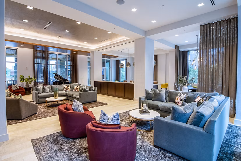 Clubhouse featuring modern design and cozy seating at Piedmont House Apartments in Atlanta