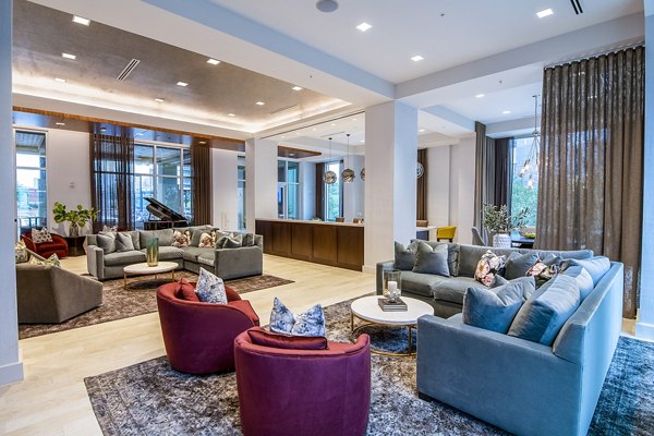 Clubhouse featuring modern design and cozy seating at Piedmont House Apartments in Atlanta