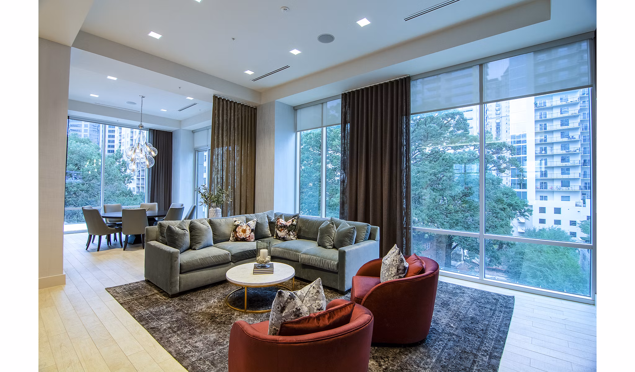 Modern clubhouse featuring a spacious lounge and bar area at Piedmont House Apartments