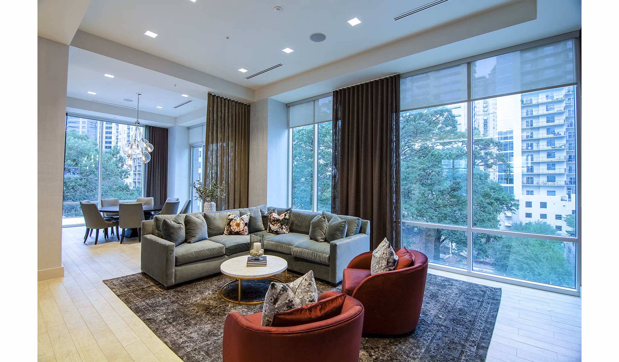 Modern clubhouse featuring a spacious lounge and bar area at Piedmont House Apartments