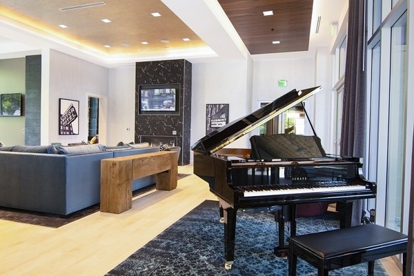 Clubhouse featuring modern decor and seating at Piedmont House Apartments, a luxury community by Greystar in a vibrant location