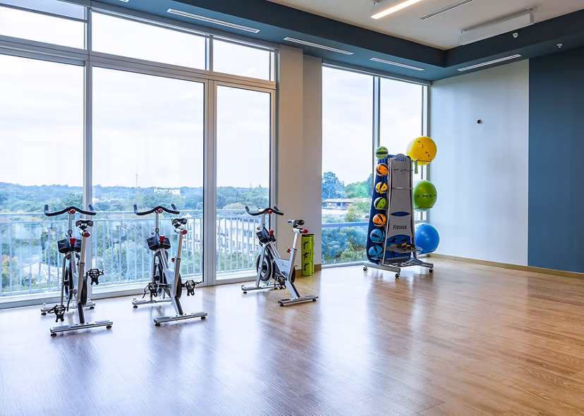 Yoga and spin studio with modern equipment at Piedmont House Apartments